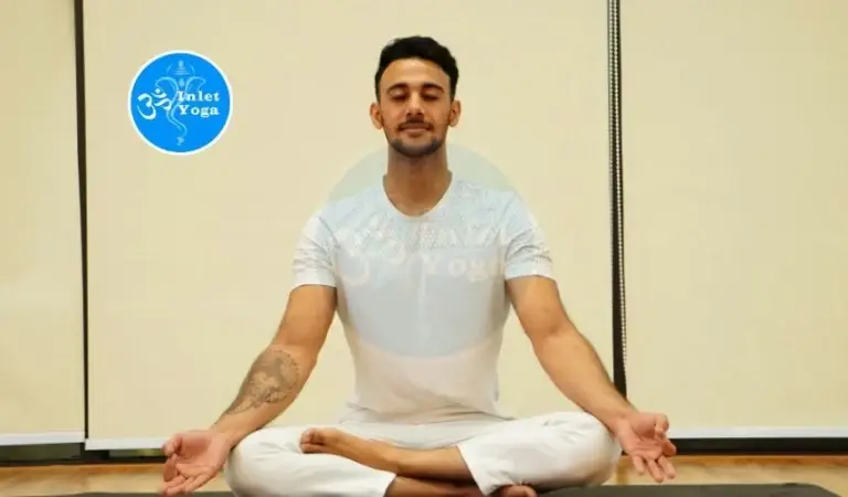 Man meditating in lotus pose during a Yoga Practice session at Inlet Yoga studio in Manasquan, NJ